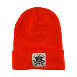 Hunter's orange fold-up knit beanie featuring a white patch on the front displaying a black & white Teton Valley Skijoring logo